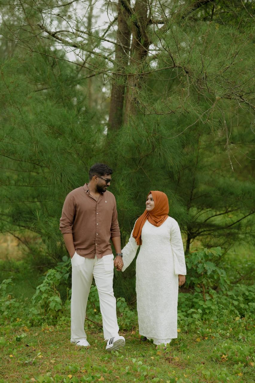 Mohammed and Rinsha walking together in the forest