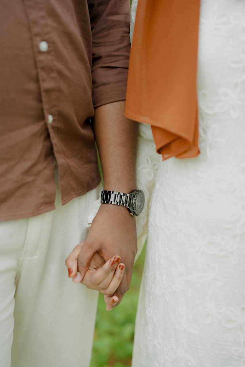 Mohammed and Rinsha holding hands